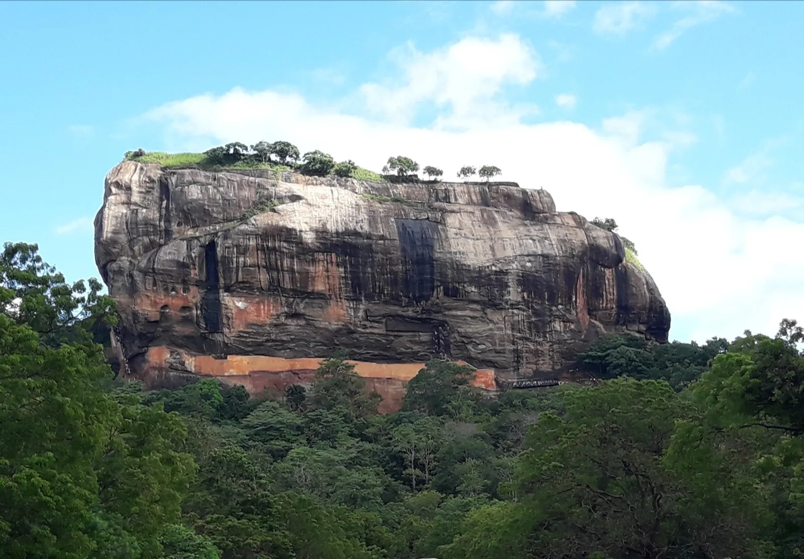 Sigiriya Rock rising above the green plains of Sri Lanka